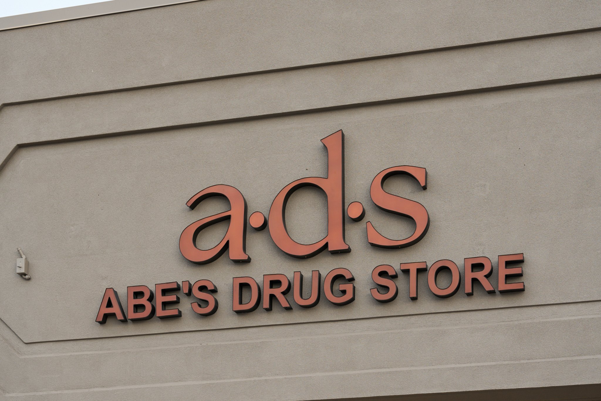 The a·d·s Abe's Drug Store sign on the storefront