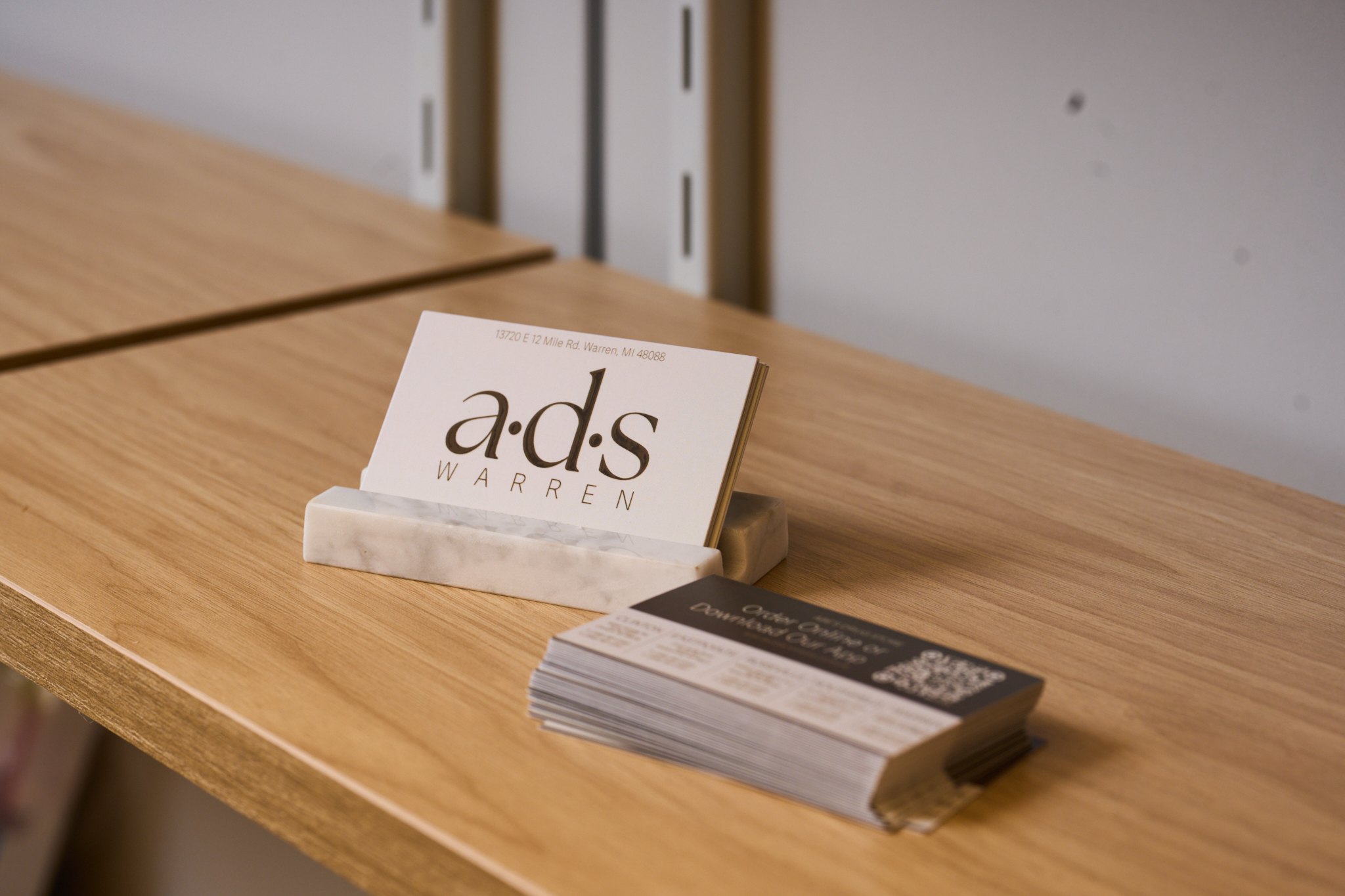 a·d·s Warren business cards in a marble holder